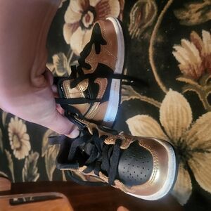 Jordan Gold and Black Sneakers with Sleek Design